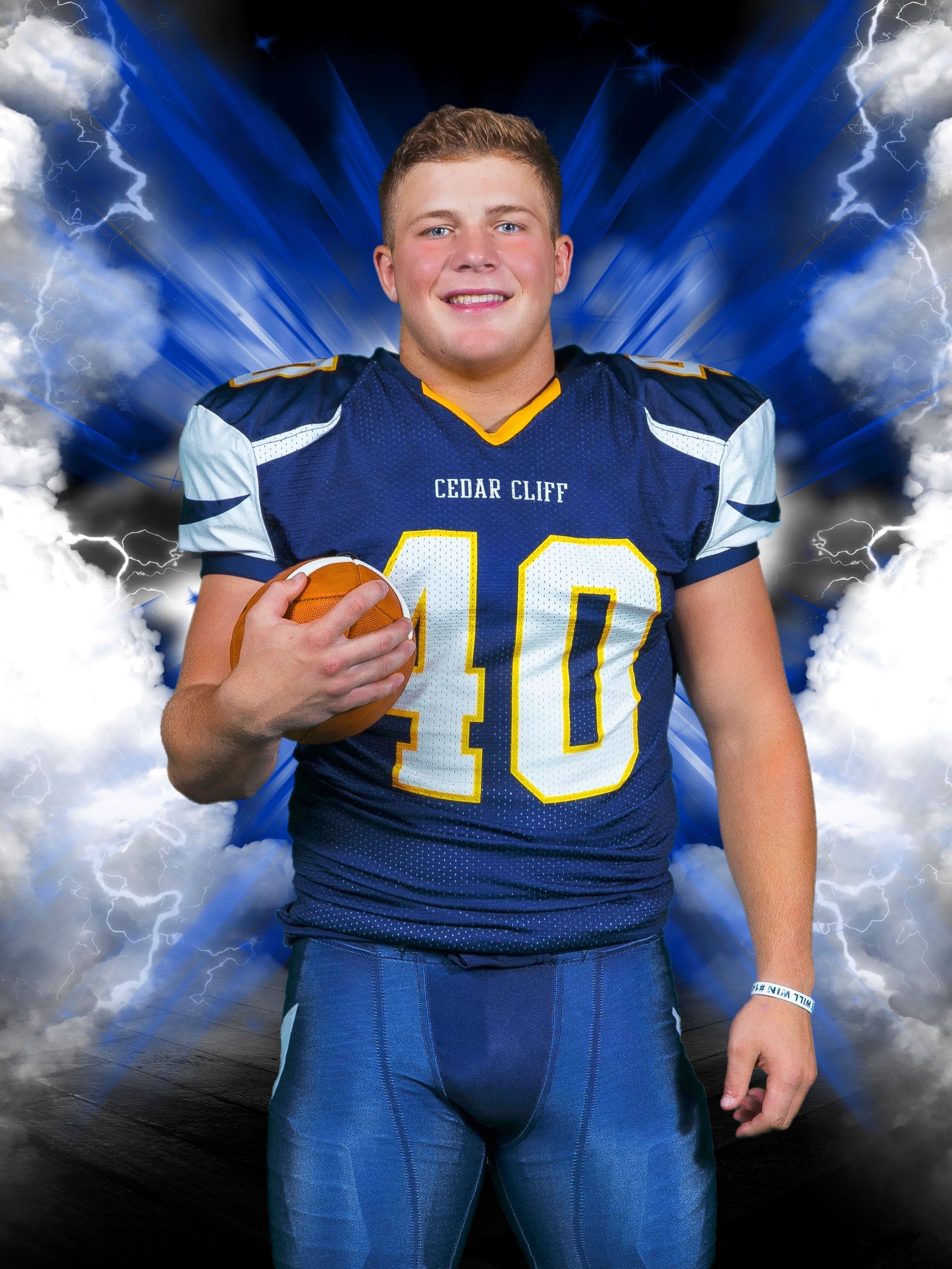 Football player in blue and gold uniform holding a football against a lightning-themed backdrop