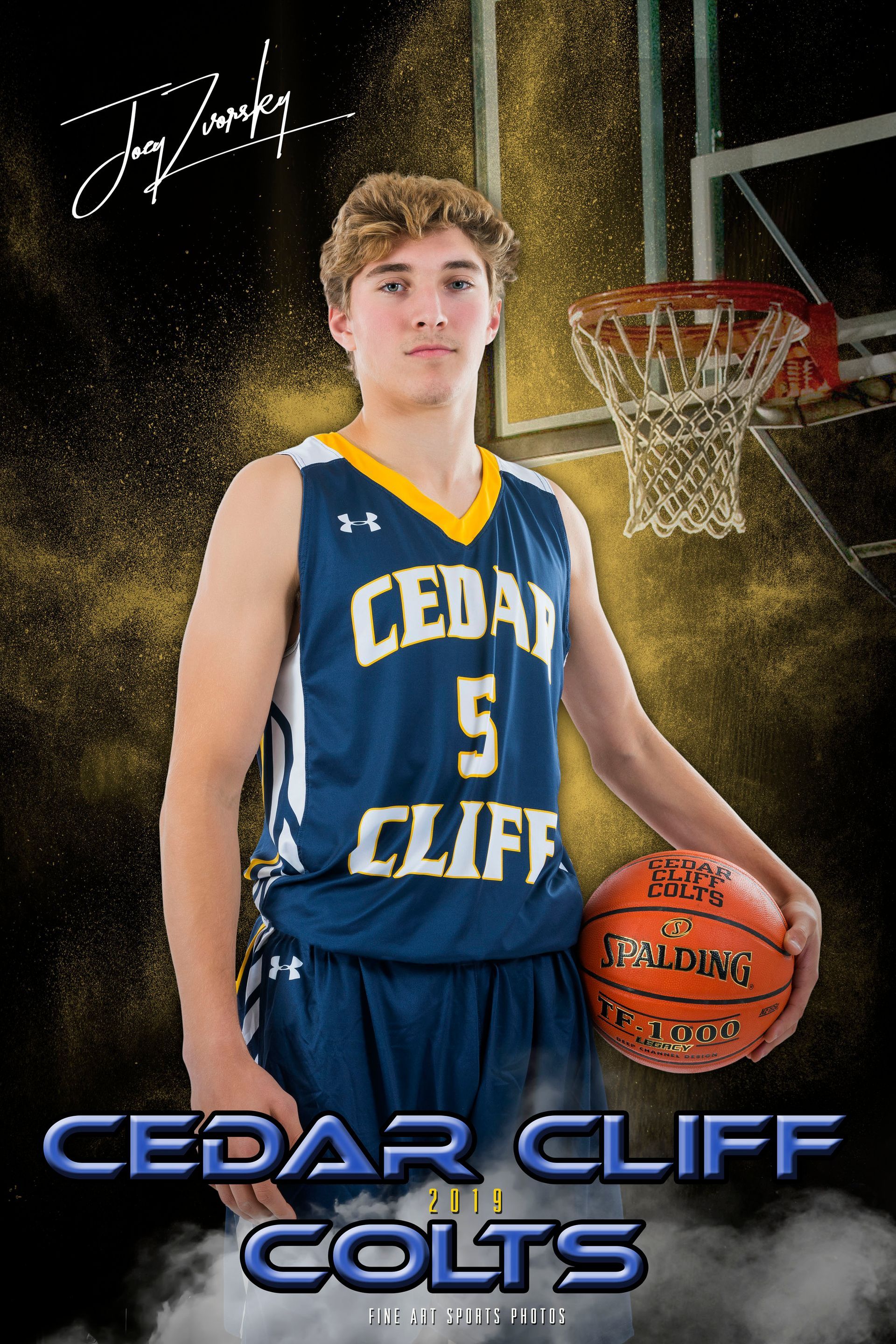 Cedar Cliff Colts basketball player in blue jersey holding a basketball on a court.