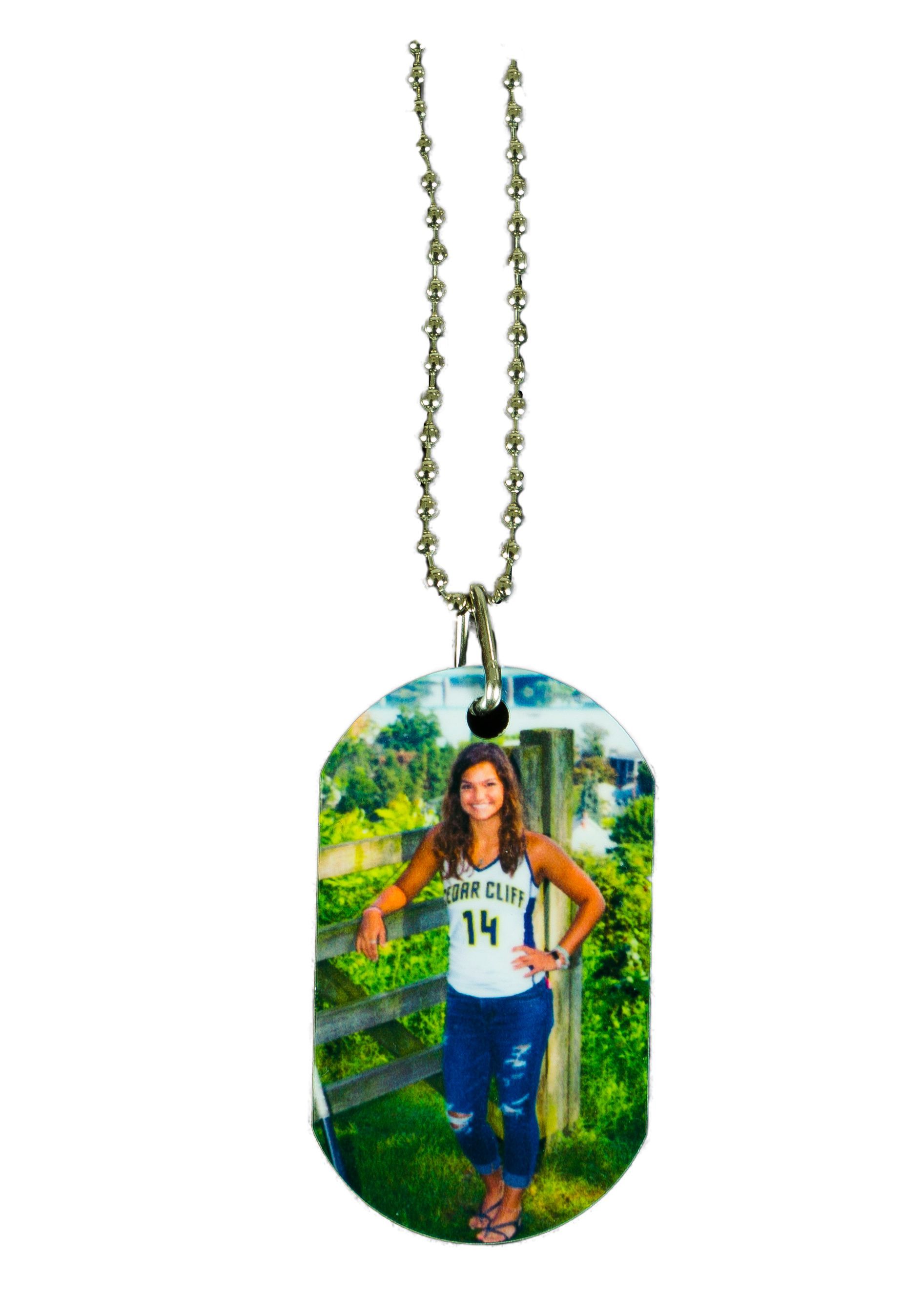 Oval pendant necklace with a small outdoor photo of a person standing by a fence and greenery