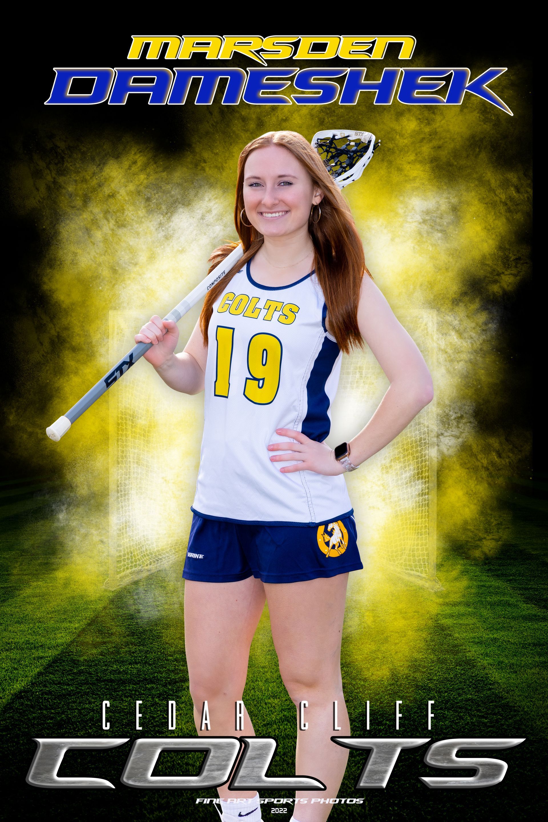 Girl in white and blue volleyball uniform posing with a bat on a smoky green-and-gold team poster, “COLTS” text below