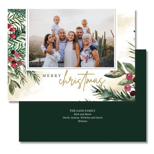 Christmas card with a family photo, gold “Merry Christmas” text, and floral greenery on white and dark green backgrounds