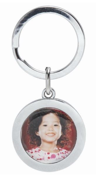 Silver keychain with a round pendant holding a small portrait photo