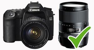 Canon camera with two lenses, one marked with a green check mark