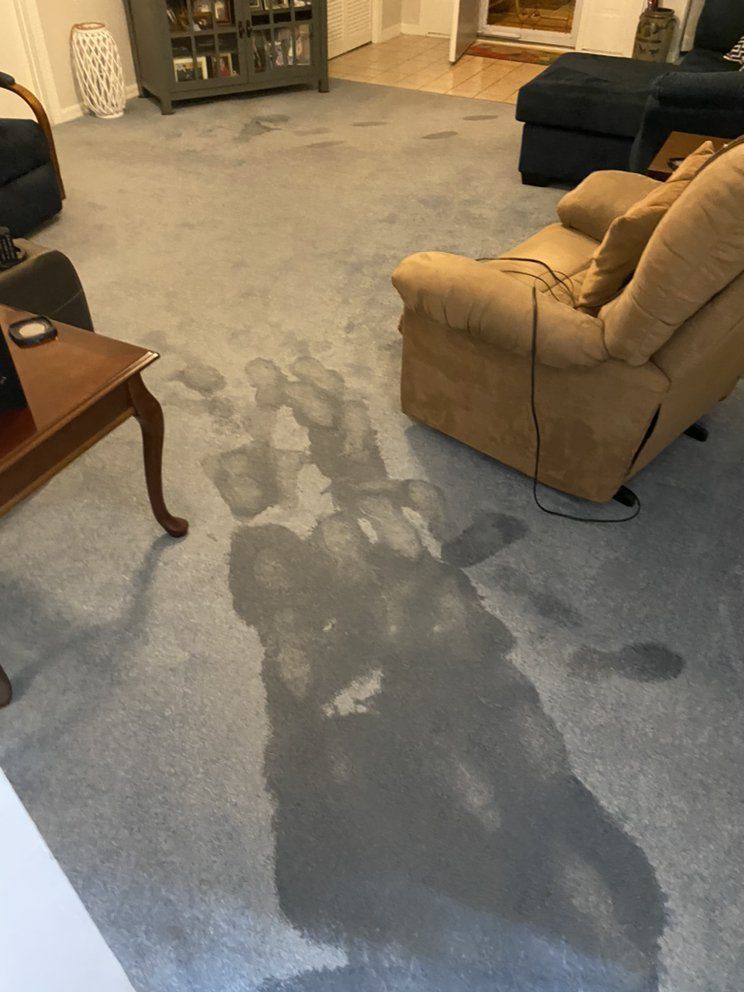 A living room with a recliner and a coffee table