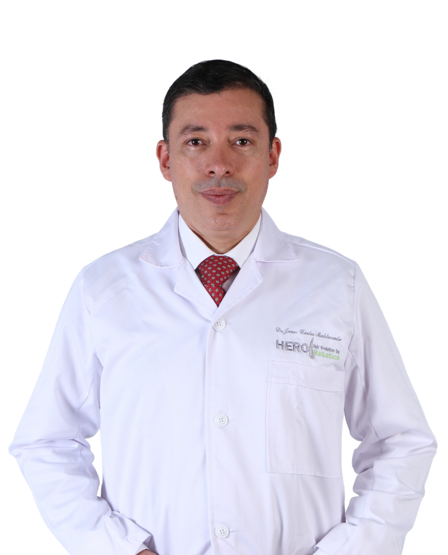 Doctor in a white lab coat and red tie standing against a white background.