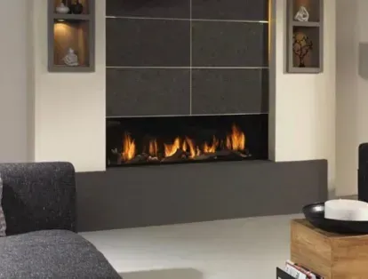 Modern fireplace with orange flames, set in a gray and white wall with built-in shelves.