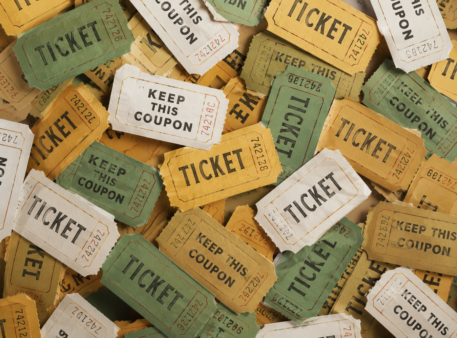 Assorted vintage ticket stubs in tan, green, and white, scattered in a pile.