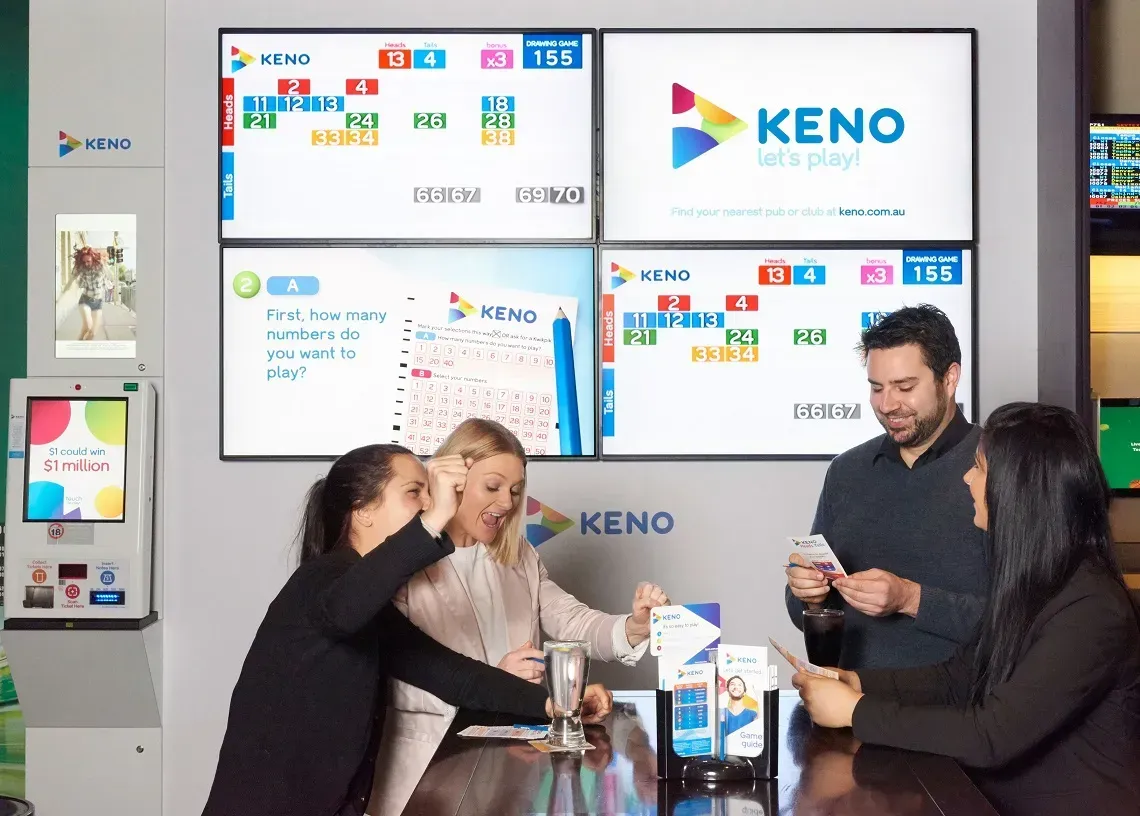 People socialising at a Keno venue with large digital screens and lottery displays
