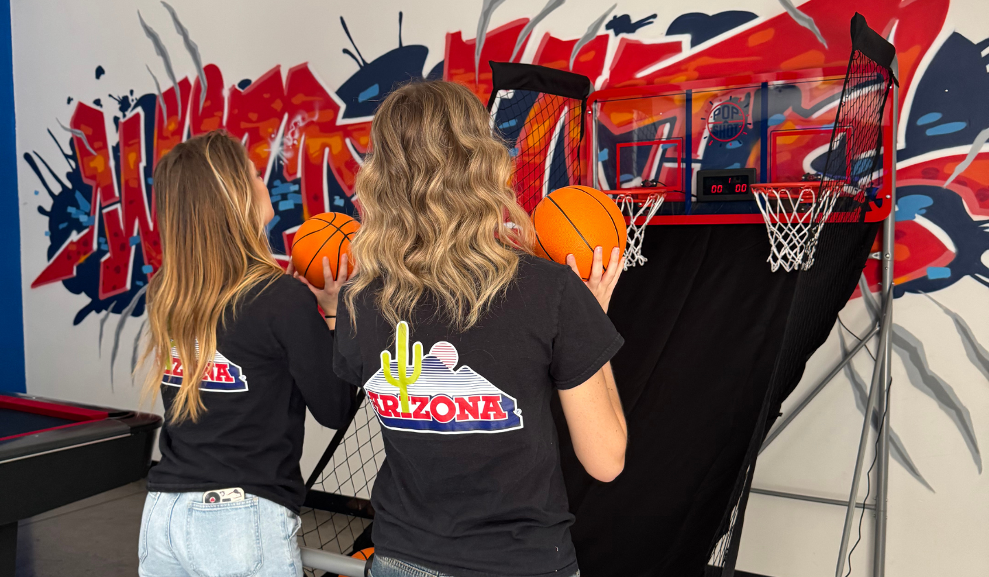 Female residents playing indoor basketball in the Clubhouse at the Seasons Tucson.