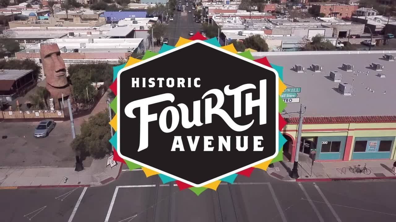 Check out the restaurants and monthly events! A sky view of buildings on Fourth Avenue building tops with the Historic Fourth Avenue logo in the center.