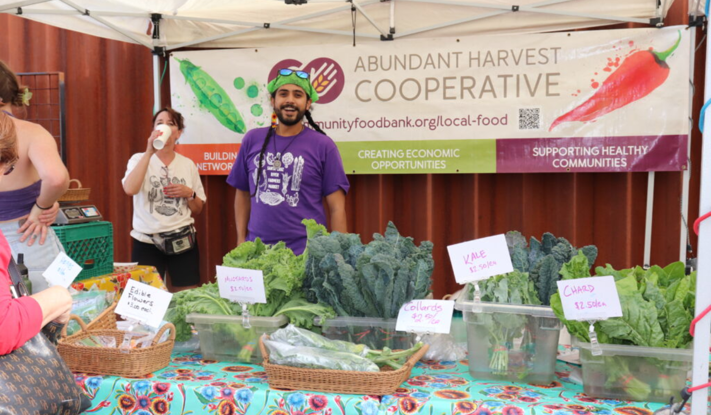 A farmer selling fresh produce at the Santa Cruz River Farmers’ Market Thursdays from 4PM - 7PM at the Mercado.