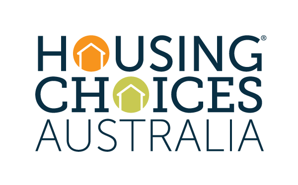 The logo for Housing Choices Australia with a dark blue text and orange and lime green house icons.