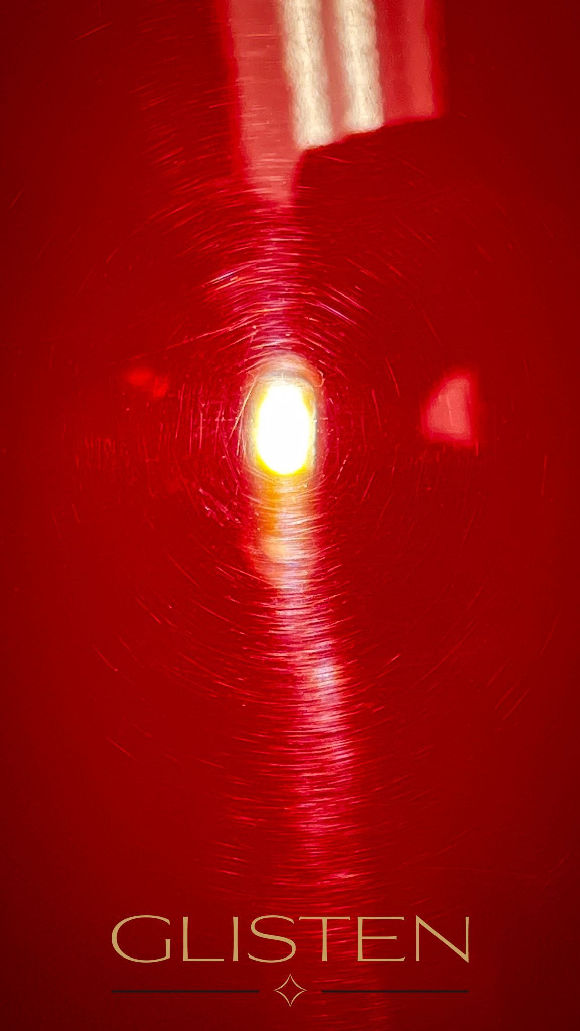 Red surface reflects light with the word 