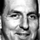 Black-and-white close-up of a smiling man’s face
