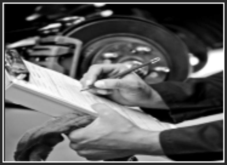 Hand filling out forms beside a car wheel and engine in black and white