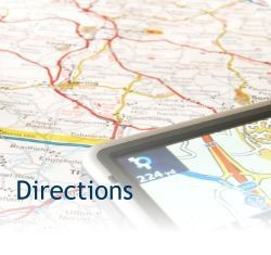 Map with magnifying glass and the word “Directions” overlaid