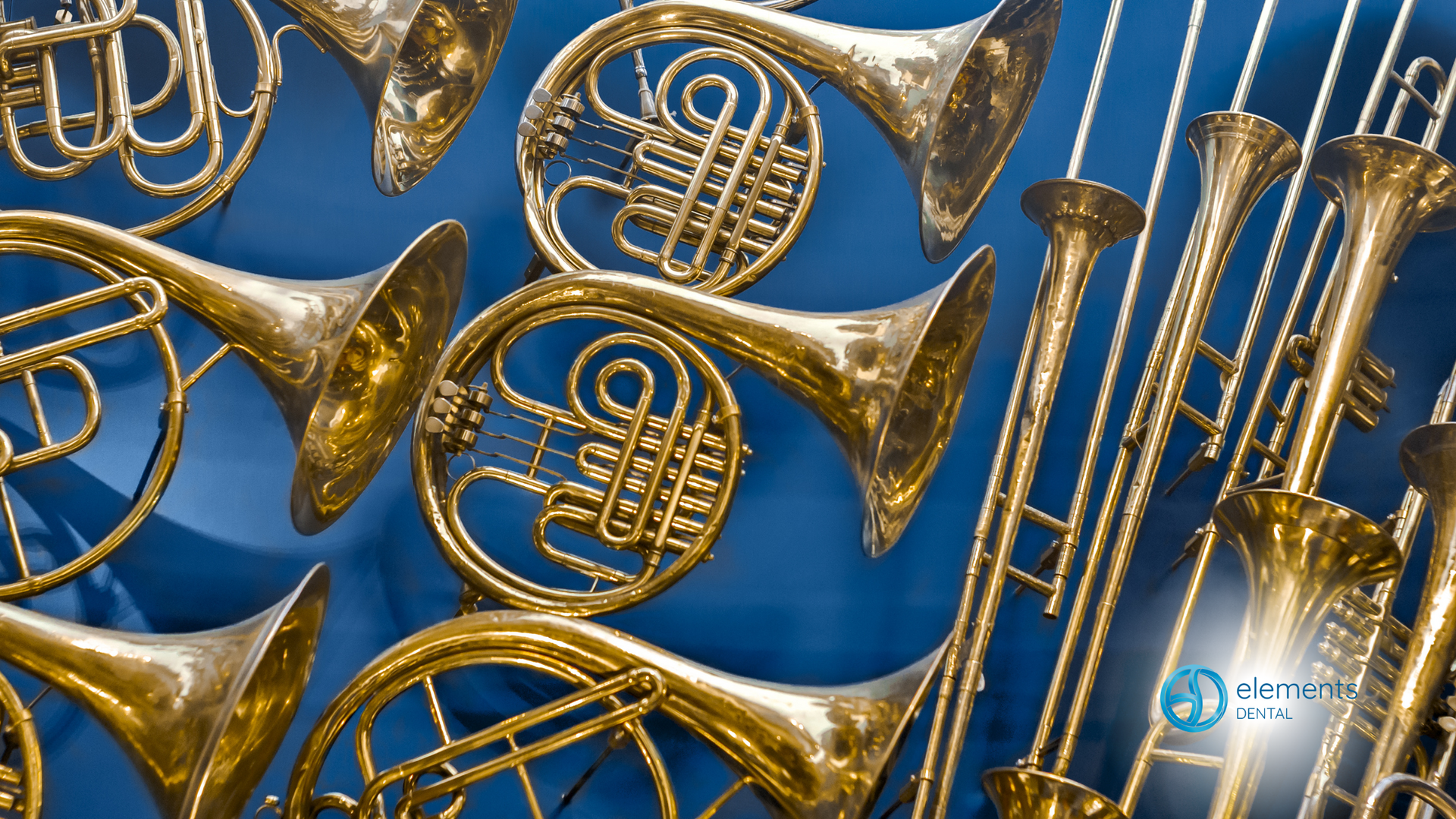 A bunch of brass instruments on a blue background