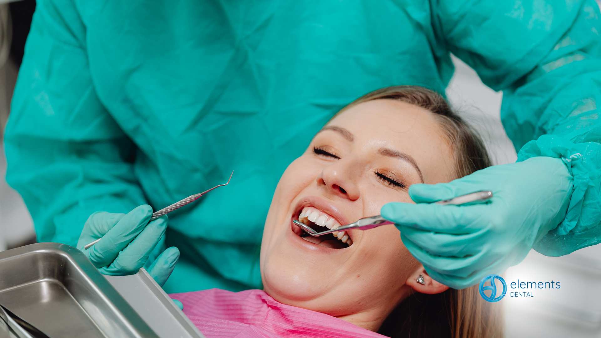 A woman is having her teeth examined by a dentist.