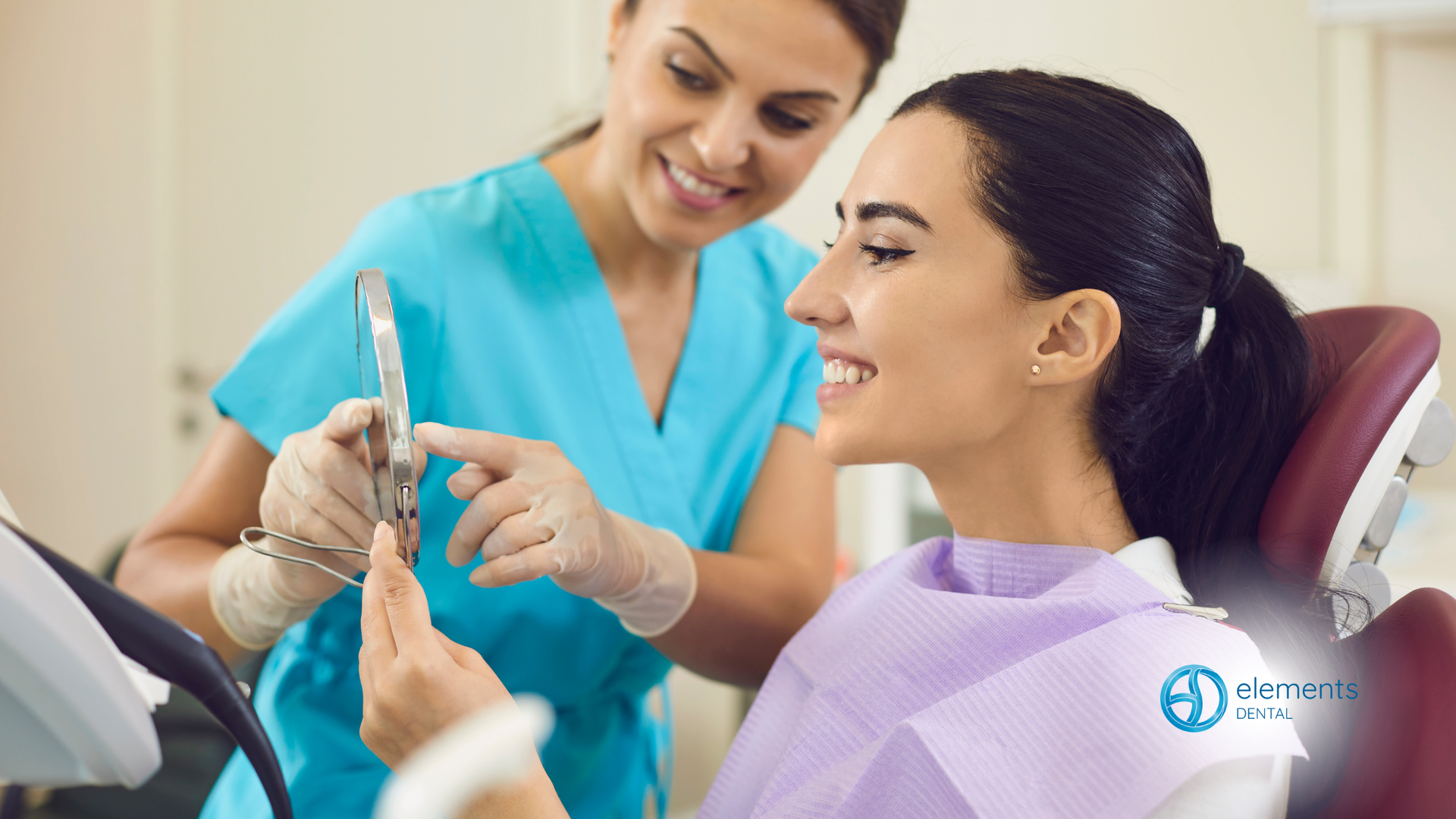 Dental professional showing a dental tool to a smiling patient in a clinic