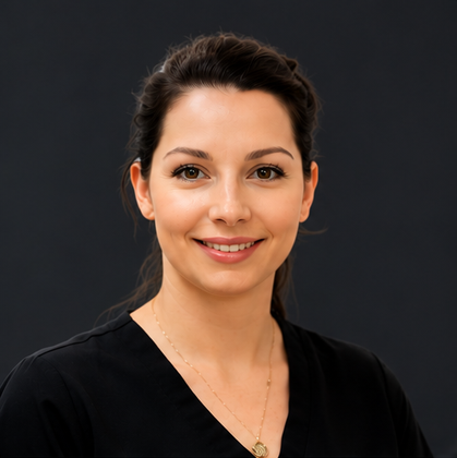 Smiling woman in a black top against a dark gray background