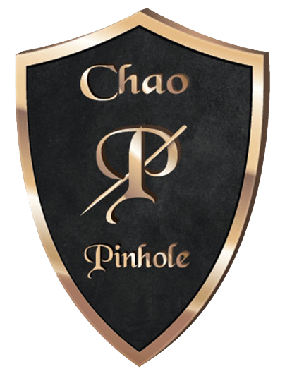 Black and gold shield logo reading “Chao Pinhole” with a stylized monogram in the center
