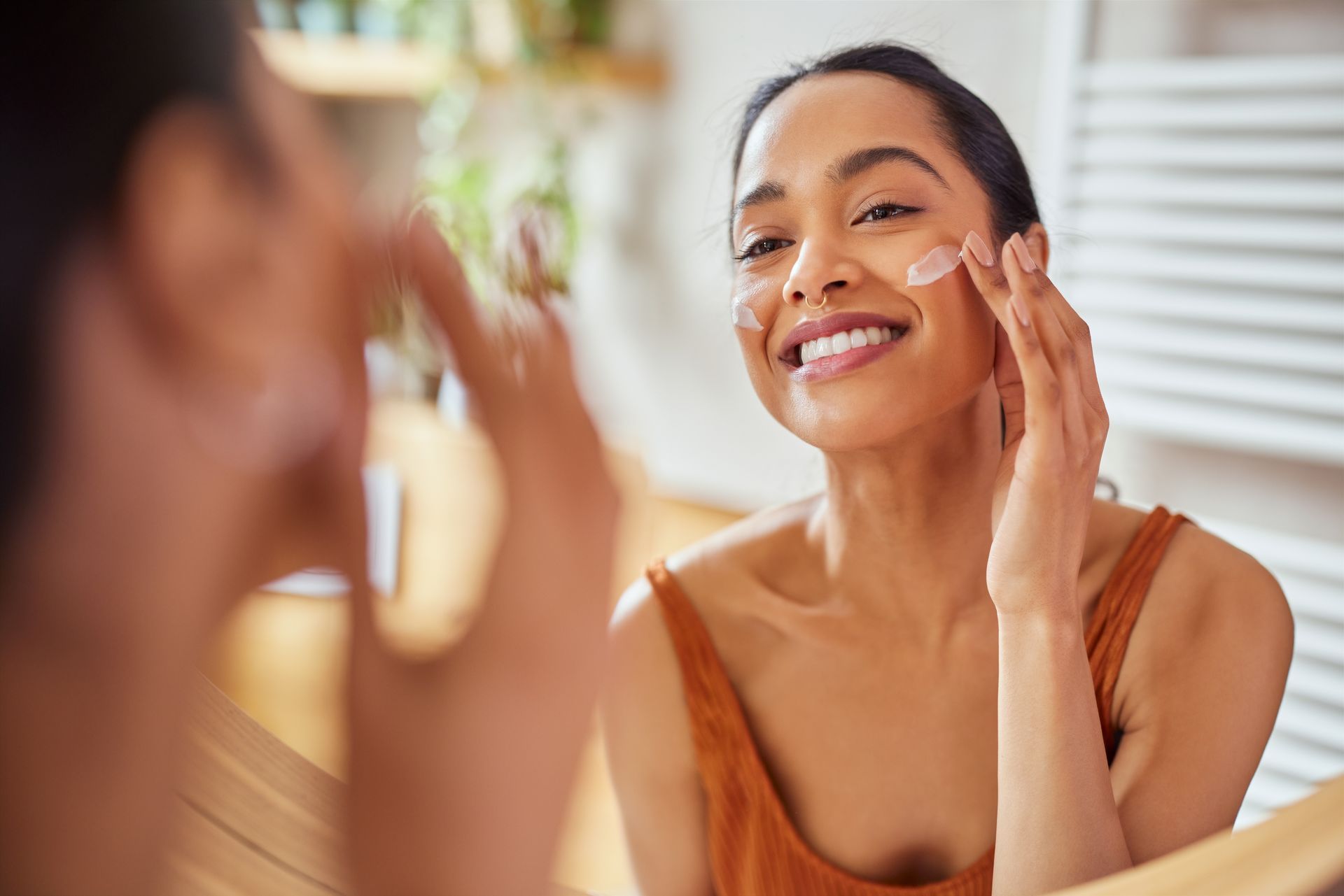 A woman doing her skincare routine in the spring A woman doing her skincare routine in the spring