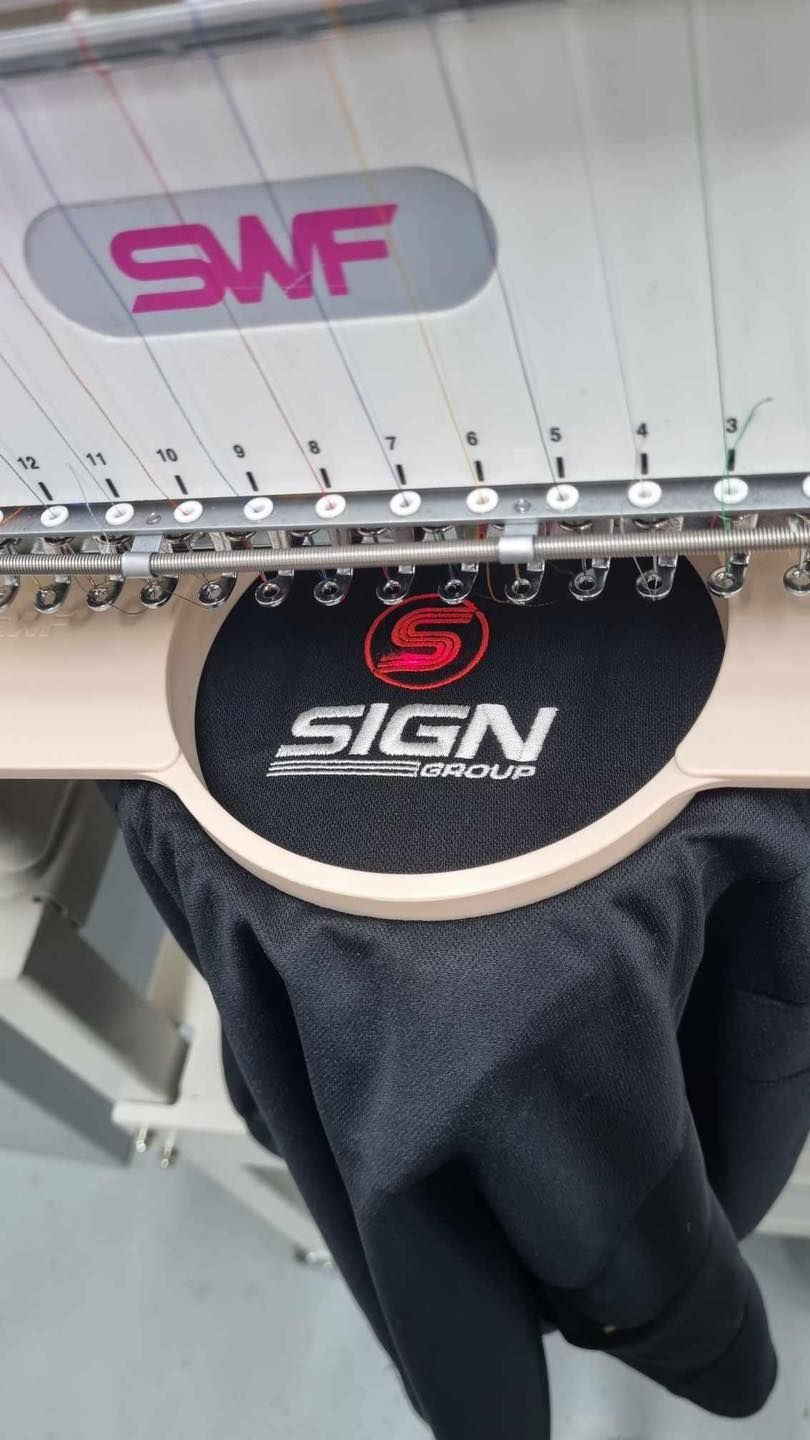 Workwear Products Being Made With Embroidering — Workwear in Dubbo, NSW