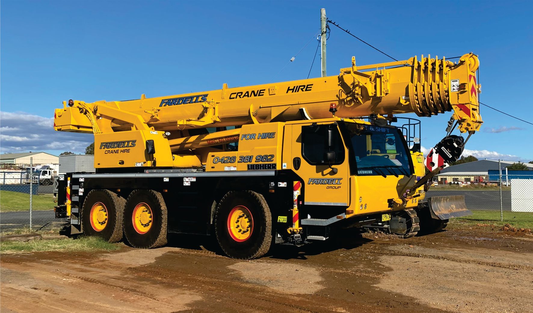 Crane With Signage — Embroidery in Cobar, NSW