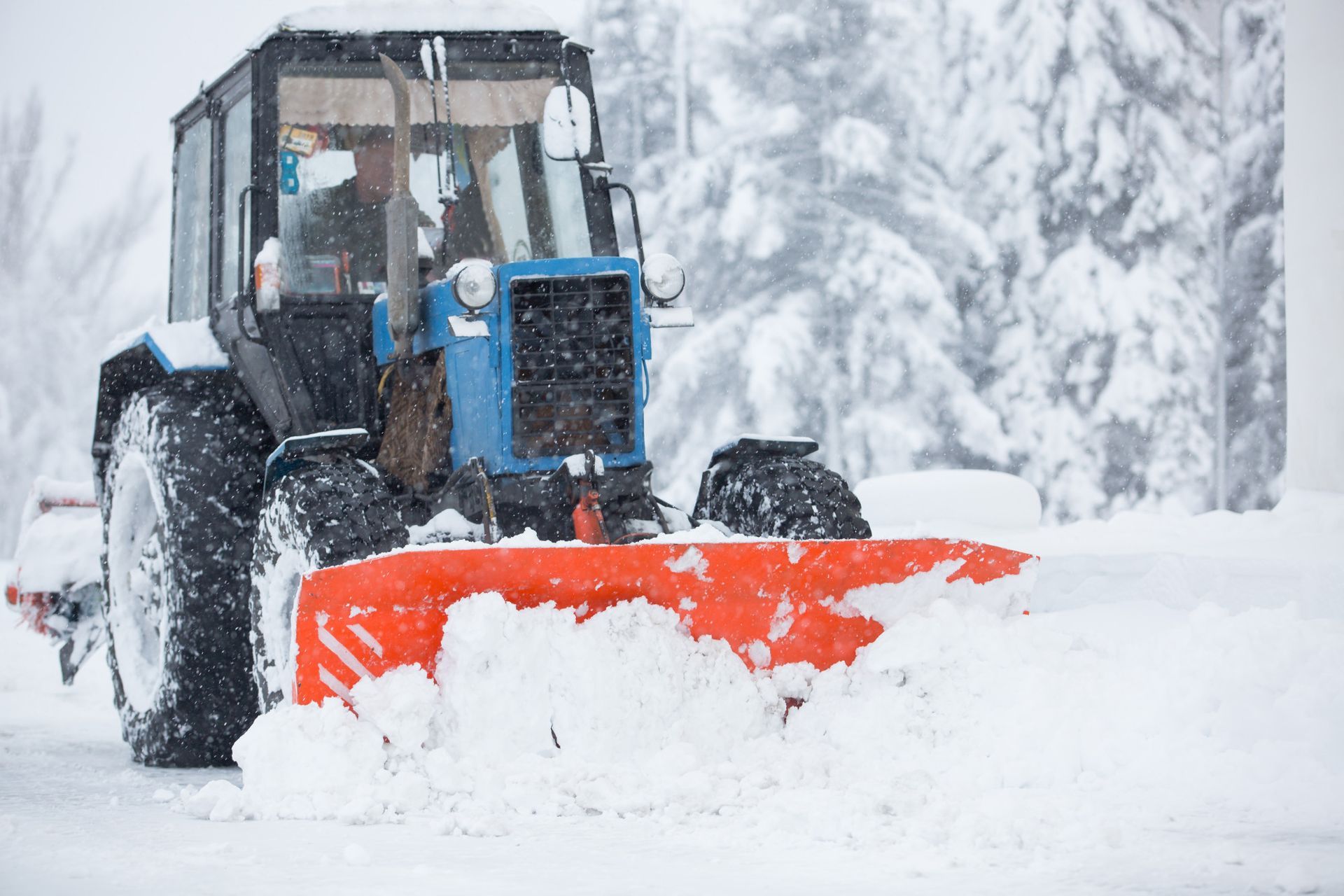 snow removal utility equipment cleans the snow on the streets
