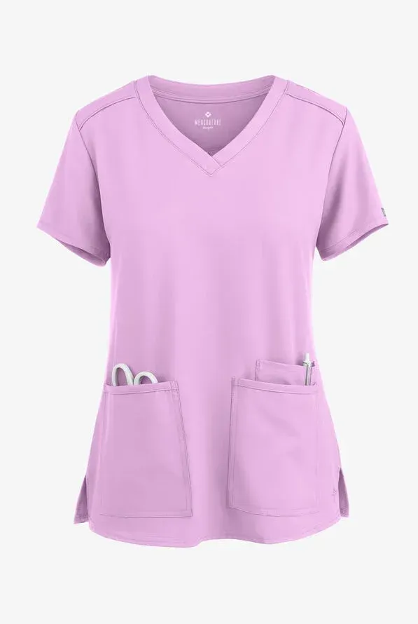 Lavender V-neck scrub top with two front pockets, holding scissors, and side slits.