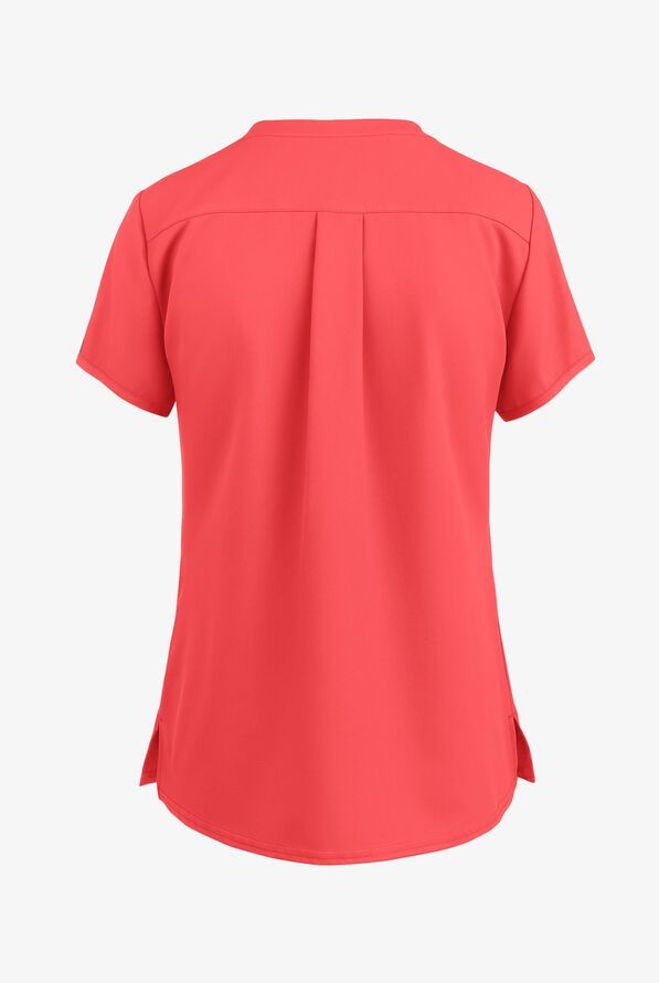 Back view of a coral-colored short-sleeved top with a pleated back, collarless neckline, and side slits.
