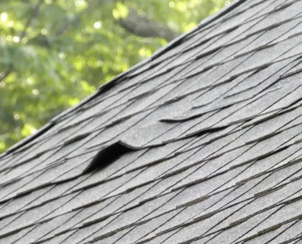 A close up of a roof with a hole in it.