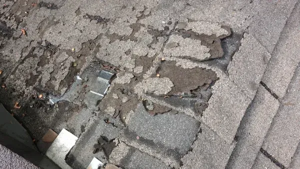 A close up of a roof with a hole in it.