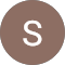 The letter s is in a brown circle on a white background.
