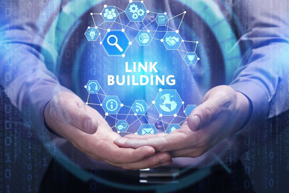 A man is holding a virtual screen with the words `` link building '' on it.