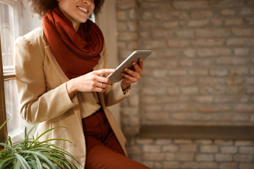 woman surfing internet on tablet