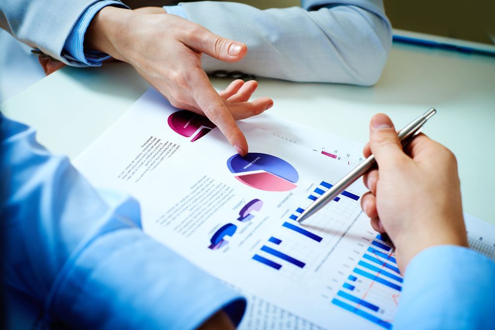 colleagues discussing business document