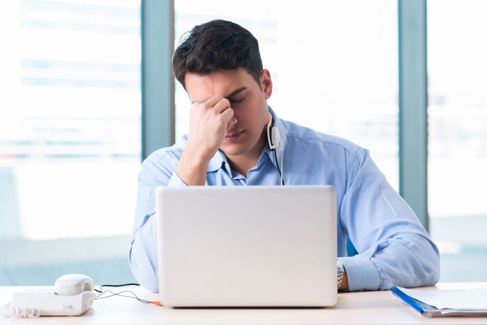 frustrated male customer at computer