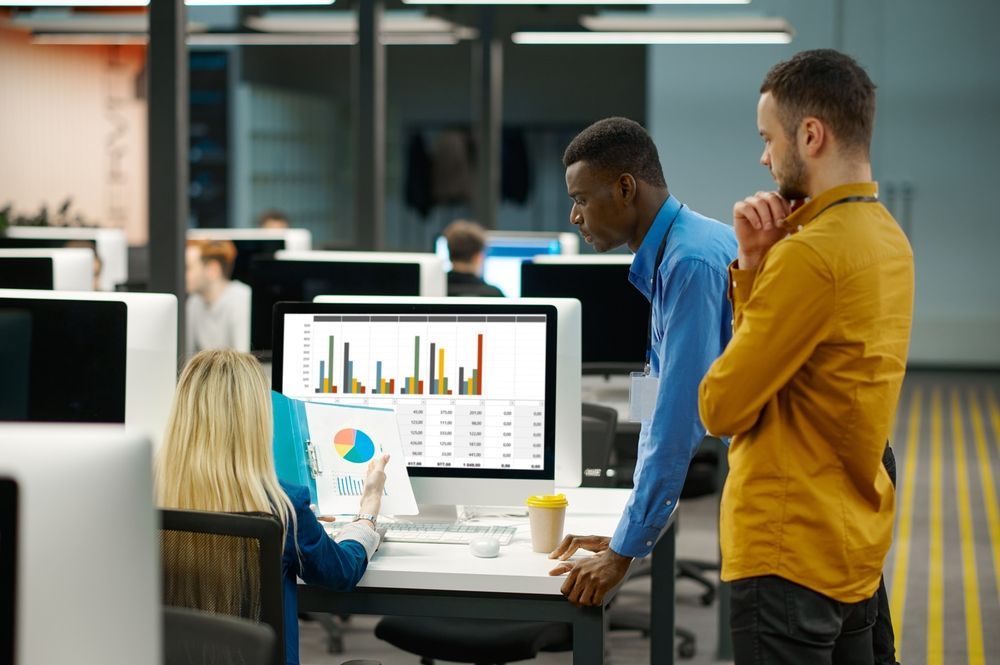 team looking at reports