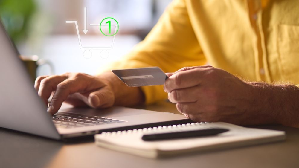 man paying for item online