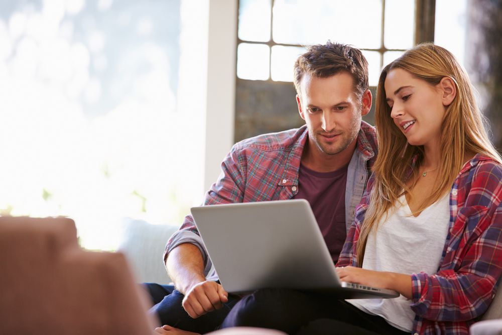 couple looking at laptop