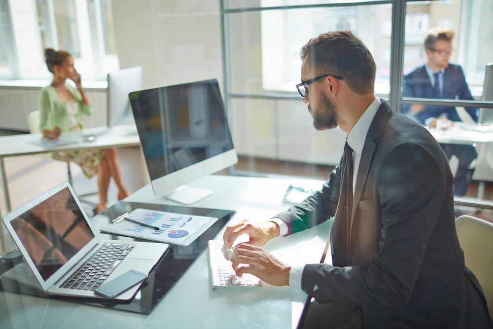 man looking at computer