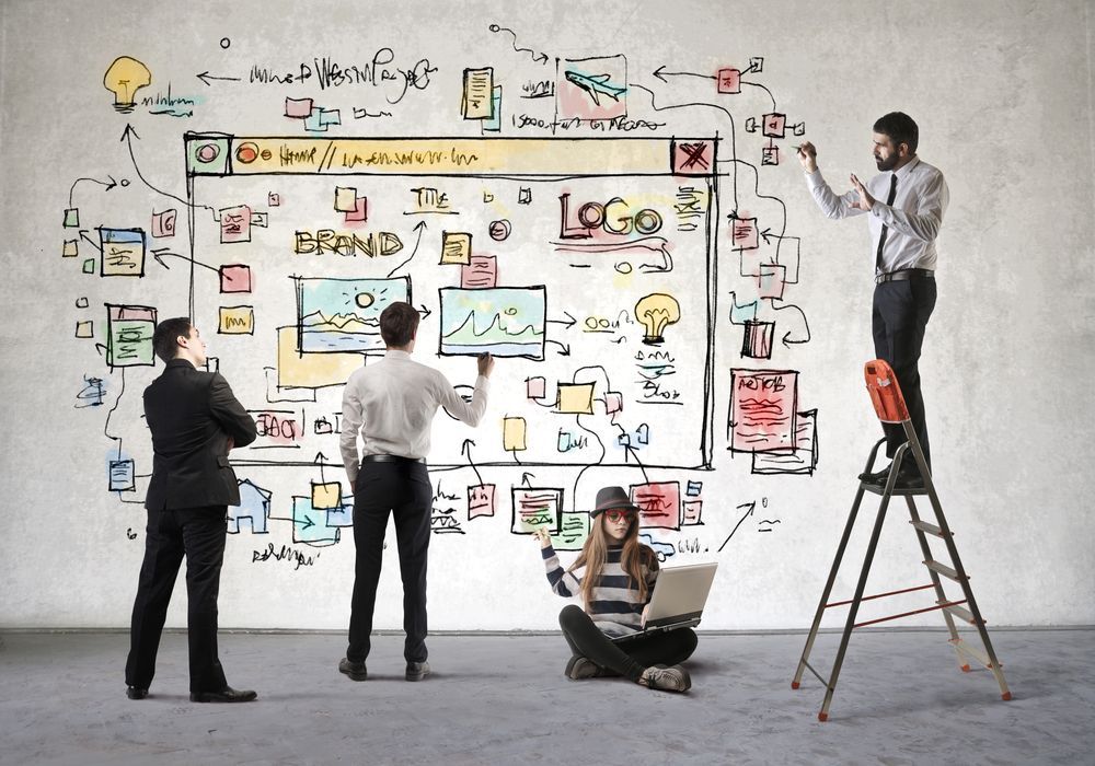 Group of designers mapping out website