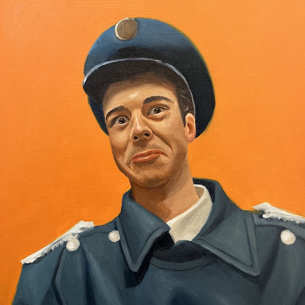 A person in a blue military-style uniform and peaked cap makes a skeptical expression against an orange background.