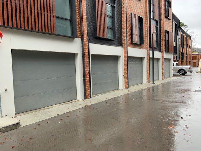 Townhouse Project Colourbond Sectional Doors — Canberra, ACT — Capital Doorworks