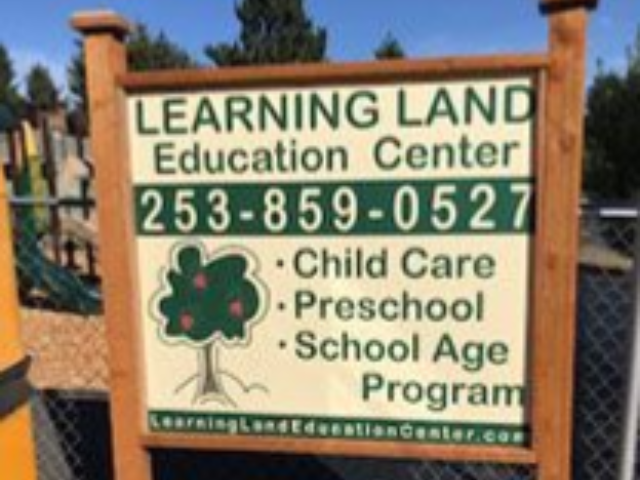 Sign for Learning Land Education Center with phone number, child care, preschool, and school age program listed.