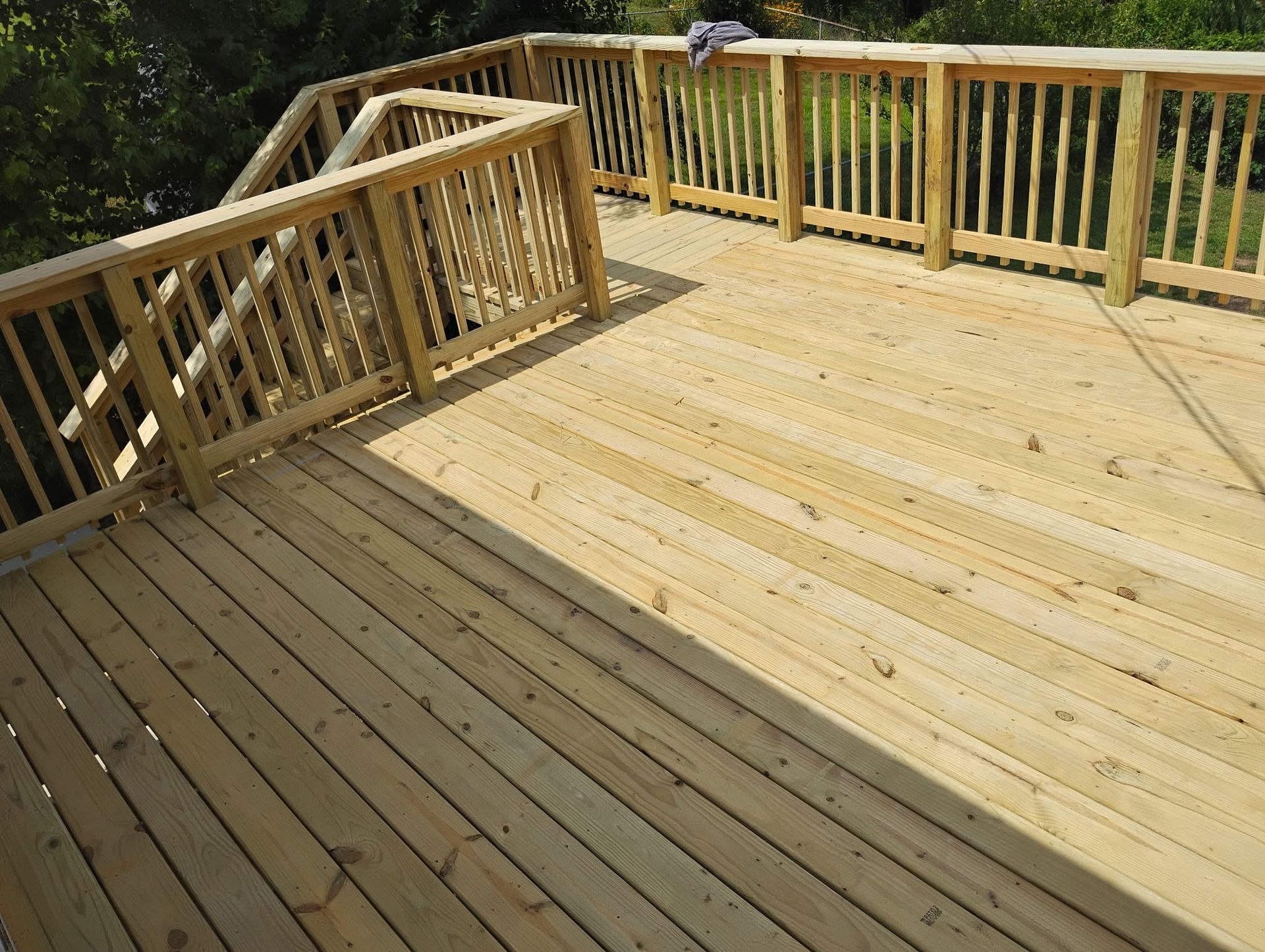 Custom pressure treated wood deck with wood spindles