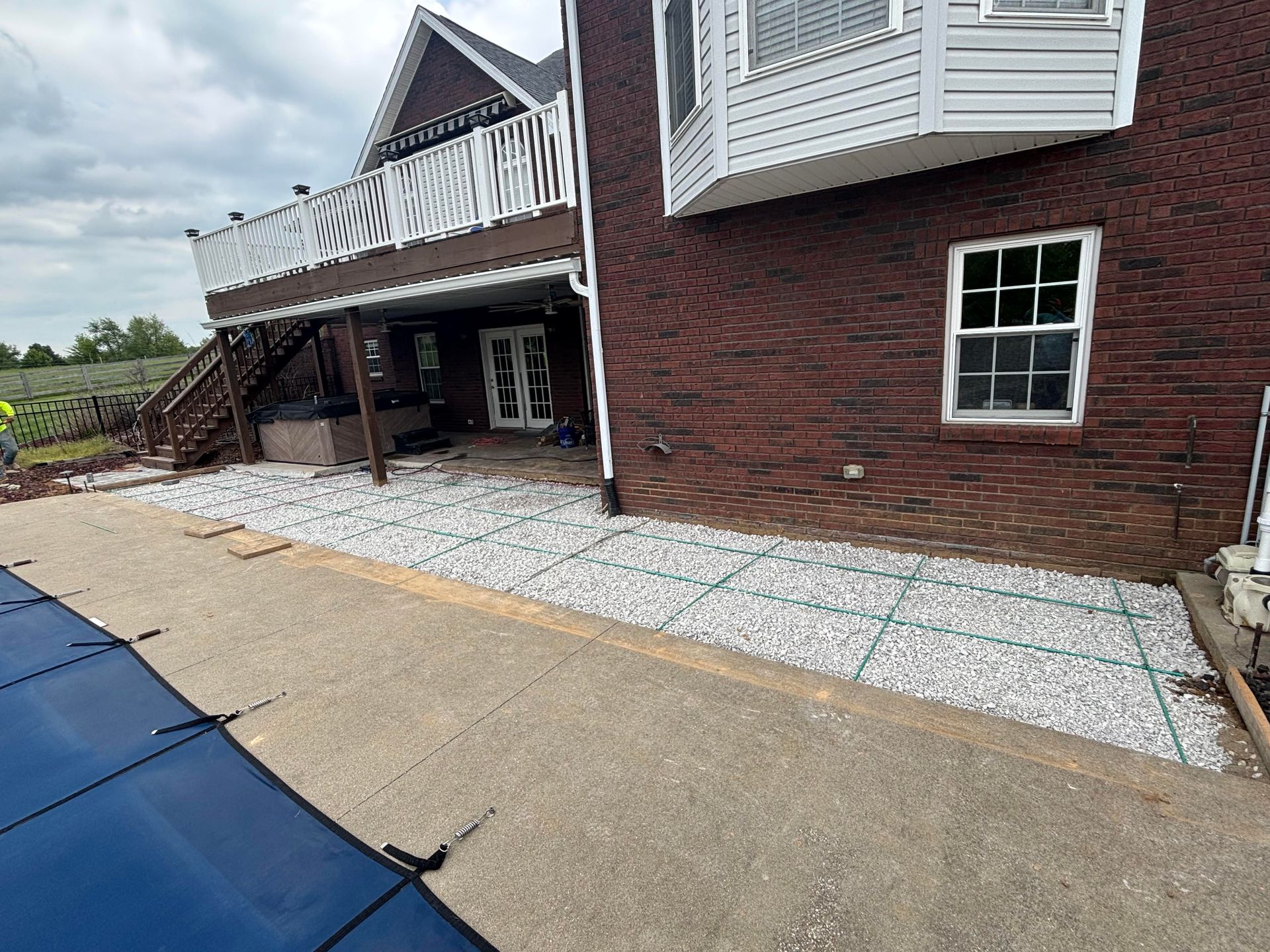 Formed before poured concrete patio extension beside a swimming pool, providing additional outdoor space in Glendale, KY