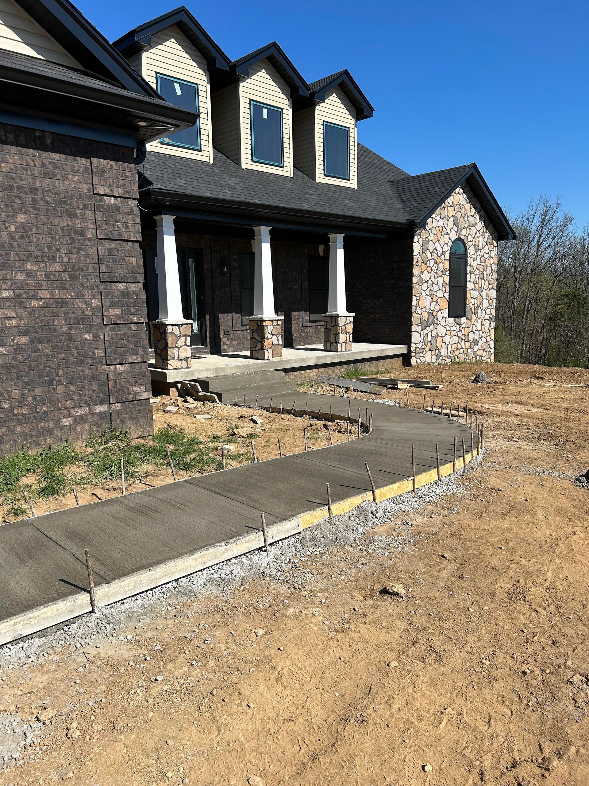 Custom concrete sidewalk featuring a broom finish, completed by Right At Home Construction LLC in Bardstown, KY