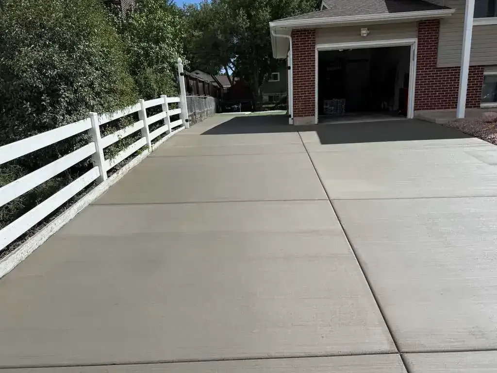 Professionally poured and finished residential concrete driveway installed by Right At Home Construction LLC in Central KY